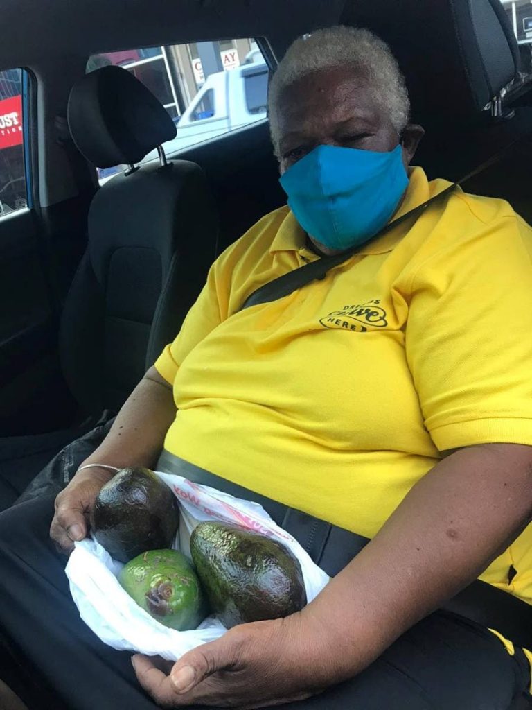 Vera McEachrane shows some of her tainted avocados. She claims that a fellow villager of Betsy Street, La Romaine has been purposefully poisoning her avocado tree for the last seven months. - 