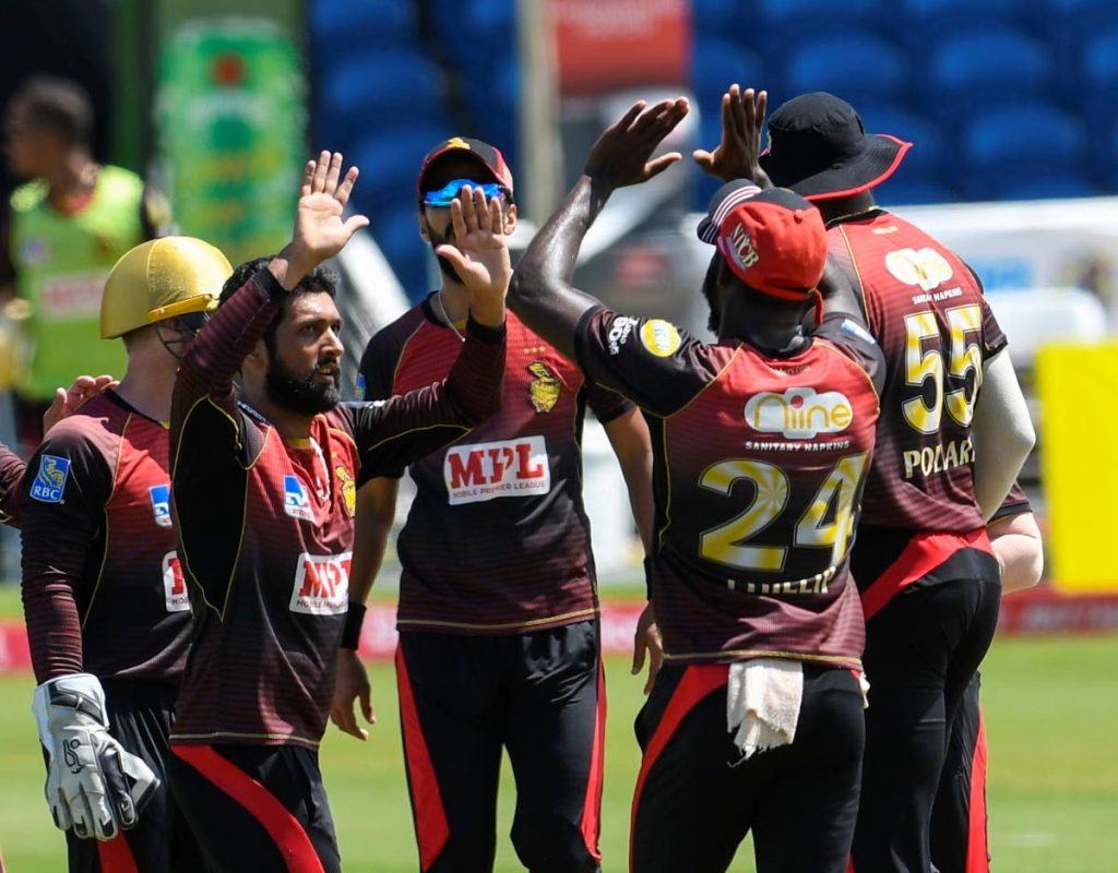 Sikandar Raza (L) of Trinbago Knight Riders celebrates the dismissal of Evin Lewis of St Kitts & Nevis Patriots during the Hero Caribbean Premier League match 29 between St Kitts & Nevis Patriots and Trinbago Knight Riders at Brian Lara Cricket Academy,Tarouba, on Sunday.
 - CPL T20 via Getty Images