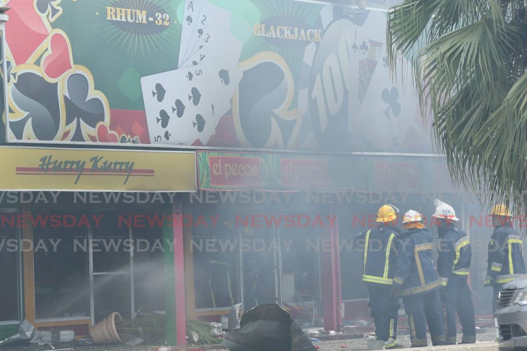 FILE PHOTO: Firefighters at El Pecos in Maraval after the explosion on February 5, 2015. - 