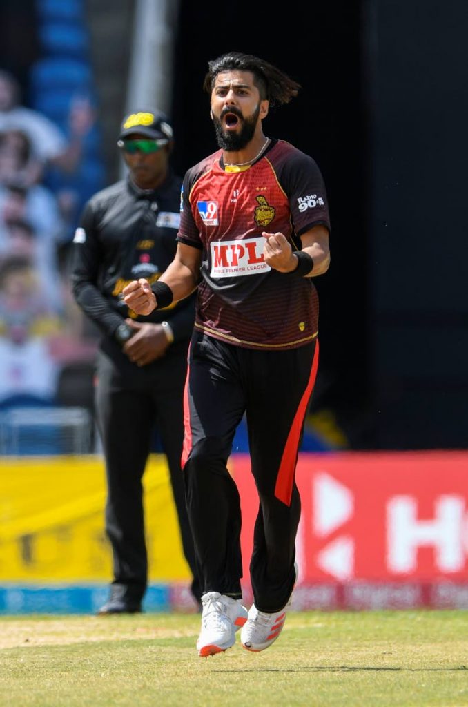 Ali Khan of Trinbago Knight Riders celebrates the dismissal of Rahkeem Cornwall of St Lucia Zouks during the Hero Caribbean Premier League final, at Brian Lara Cricket Academy, on Thursday. - CPL T20 via Getty Images