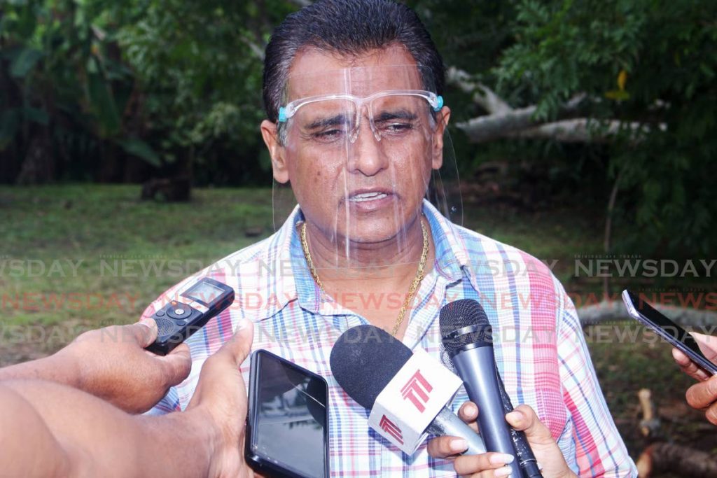 Works and Transport Minister Rohan Sinanan speaks with reporters during a tour in Gasparillo on Saturday. - CHEQUANA WHEELER