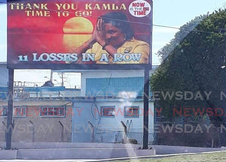 A billboard calling for the resignation of UNC leader Kamla Persad-Bissessar as party leader.  - 