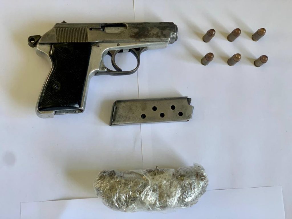 The gun, ammunition and marijuana SWDTF police found at the side of the road in LA Brea on Tuesday.  - 