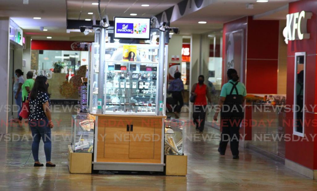 In photo, the halls of Trincity Mall see far less than usual activity last Thursday as several businesses have closed amid covid19 restrictions and rumours of a sale of the mall. - ROGER JACOB