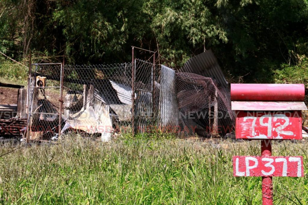 The remains of the house in which Soogrim Sookario was burnt to death on Saturday morning. - Marvin Hamilton