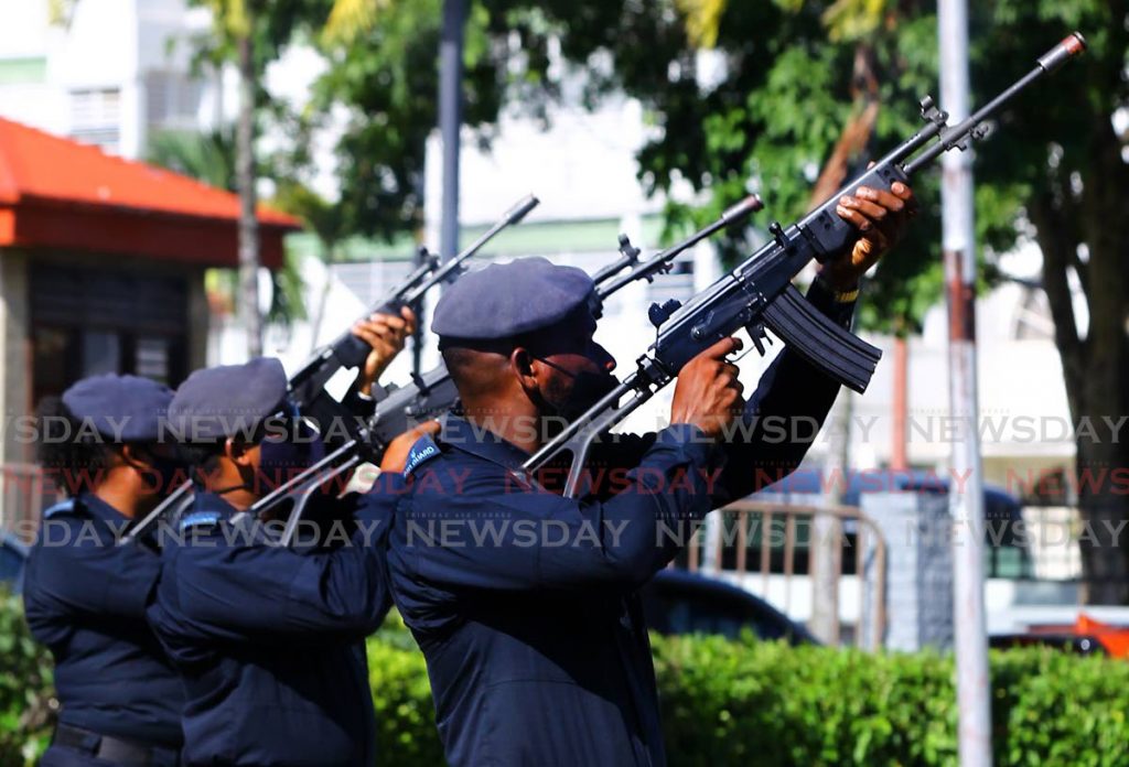 HONOUR SHOTS: Members of the military perform a 21-gun salute after Air Guard officer Sowande Morean was laid to rest on Friday at the Military Cemetery in St James. 
PHOTO BY ROGER JACOB - ROGER JACOB