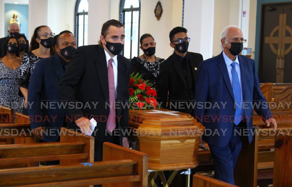LAST RITES: Pallbearers with the coffin of veteran actor Nigel Scott at his funeral on Tuesday at St Mary’s RC Church in St James.  - ROGER JACOB