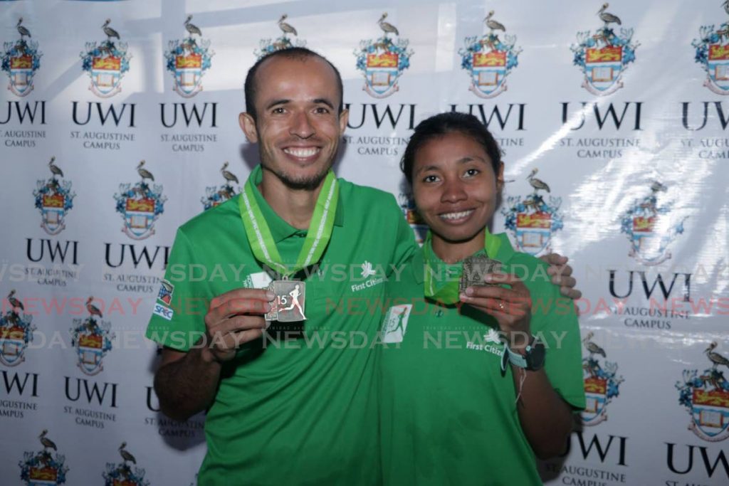 Winners of the 2018 UWI SPEC Half Marathon Didimo Armando Sanchez of Venezuela (left) and Raquel Agudelo Berrio of Colombia. PHOTO COURTESY UWI SPEC. - 