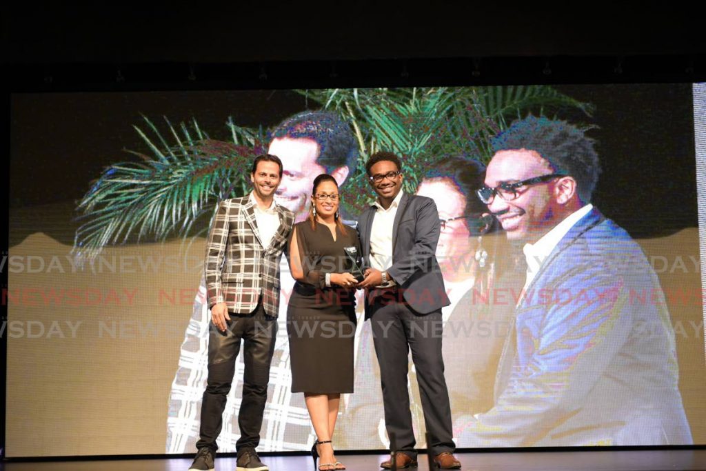 In this November 1, 2018 file photo TSTT manager enterprise marketing Siobhan Thompson celebrates with WiPay CEO Aldwyn Wayne, right, and Christian Hadeed after their company won the  TT Champions of Business business technology award sponsored by bmobile. Nominations are open for the 2020 award. - 