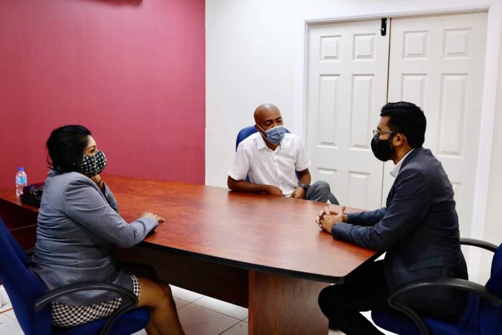 San Juan/Barataria MP Saddam Hosein chats with former PNM candidate Jason 