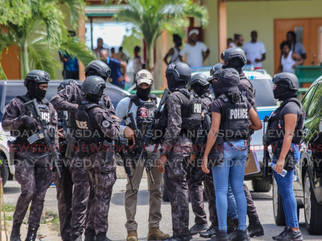 Special operations response team officers assemble at Kathleen Warner Drive, La Horquetta during investigations into the discovery of $22 million in case in a house on September 29. FILE PHOTO - 