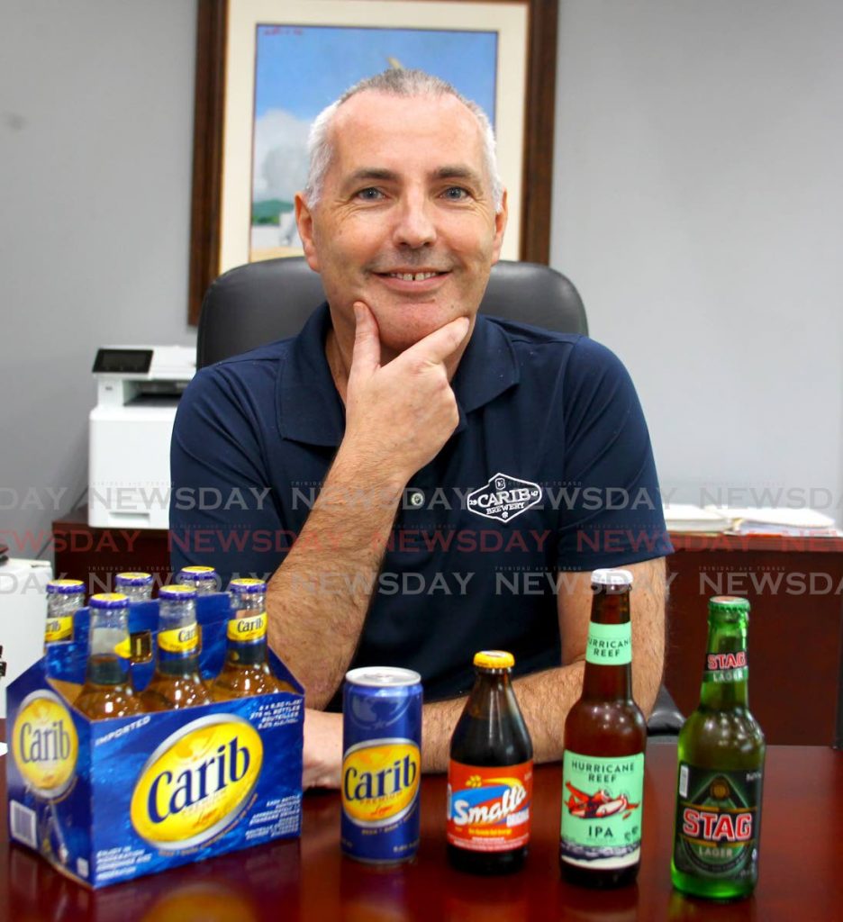 Peter Hall, beverages sector head at Ansa McAl shows some of the beverages in the product line. PHOTOS BY ROGER JACOB - 