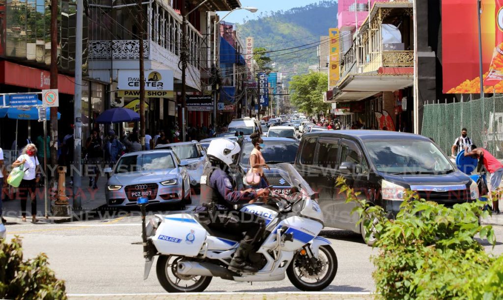 A view up a busy-looking Frederick St, Port of Spain as people go about their business under covid19 restrictions and guidelines. PHOTOS BY SUREASH CHOLAI - 