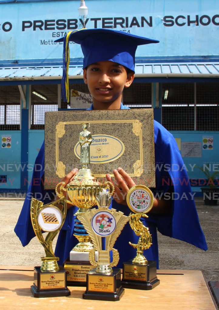 Traveer Pattron celebrates his achievements at Guiaco Presbyterian School on Wednesday. PHOTO BY ROGER JACOB - 