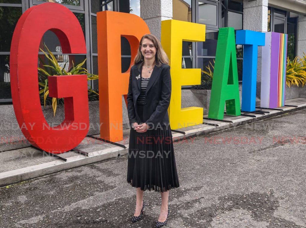 Harriet Cross, the UK High Commissioner, is workplace elegance down to her polka dot shoes at the high commission in St Clair. PHOTO BY JEFF MAYERS  - 