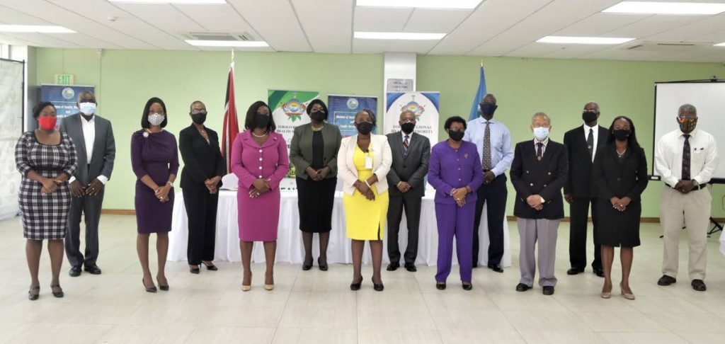 Secretary of Health, Wellness and Family Development Tracy Davidson-Celestine and Administrator of the Division Cheryl-Ann Solomon with the newly installed TRHA board and other officials of the TRHA on Monday. PHOTO COURTESY DIVISION OF HEALTH - 