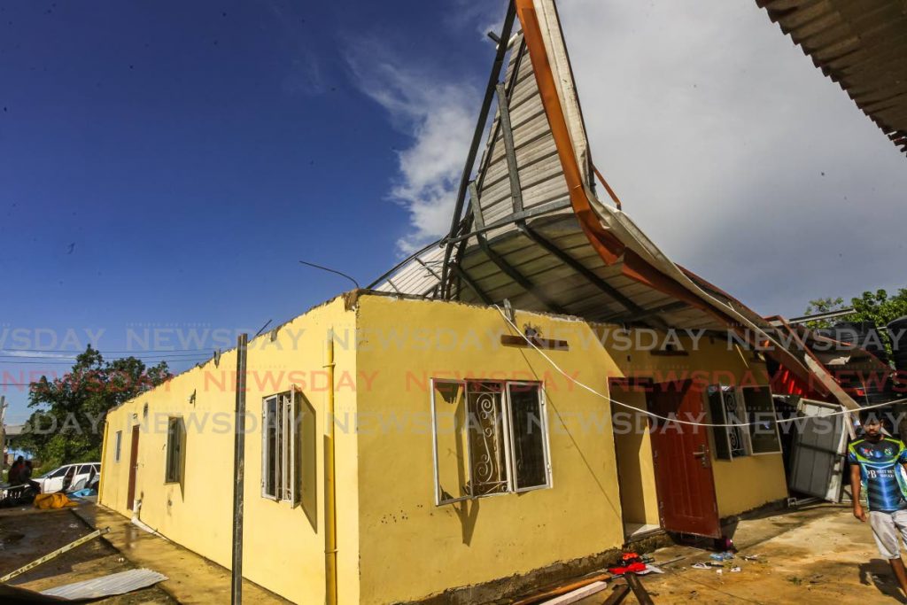 The home of Khadene Crowe and her family at lot 6C Ragonanan road east Chandanagore after what residents are calling a tornado tore the roof off their home during bad weather in the area. - Lincoln Holder