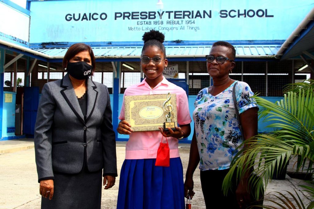 Kenya Williams with Guaico Presbyterian School principal Indira Rambaran-Mohammed and her grandmother, Magdalene Williams. - ROGER JACOB