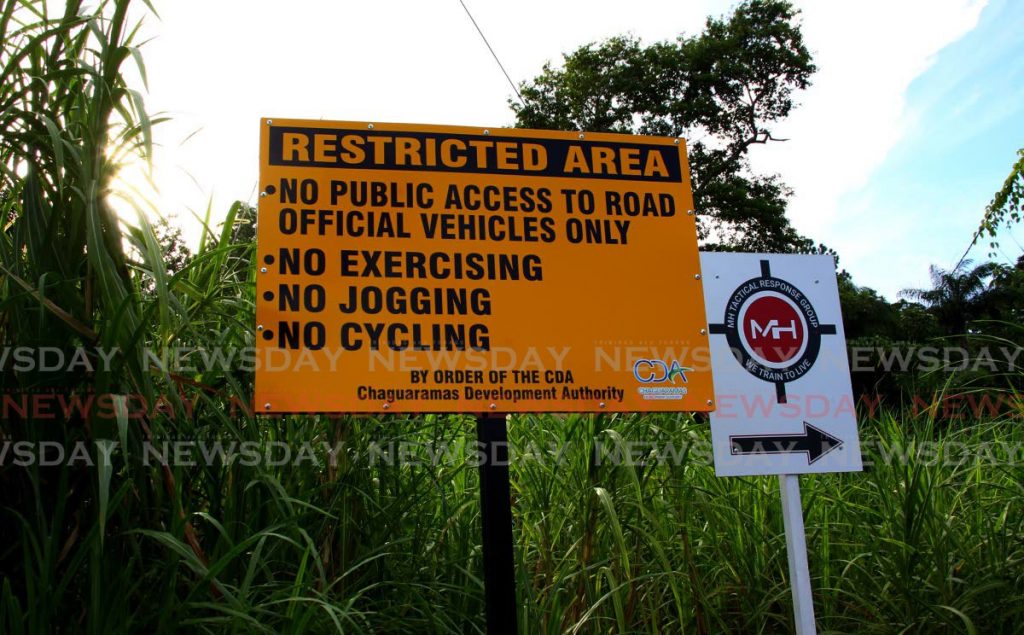 A sign placed by the CDA at the start of the trail to the Mt St Catherine peak in Chaguaramas warns that the area has now become restrictied. - ROGER JACOB