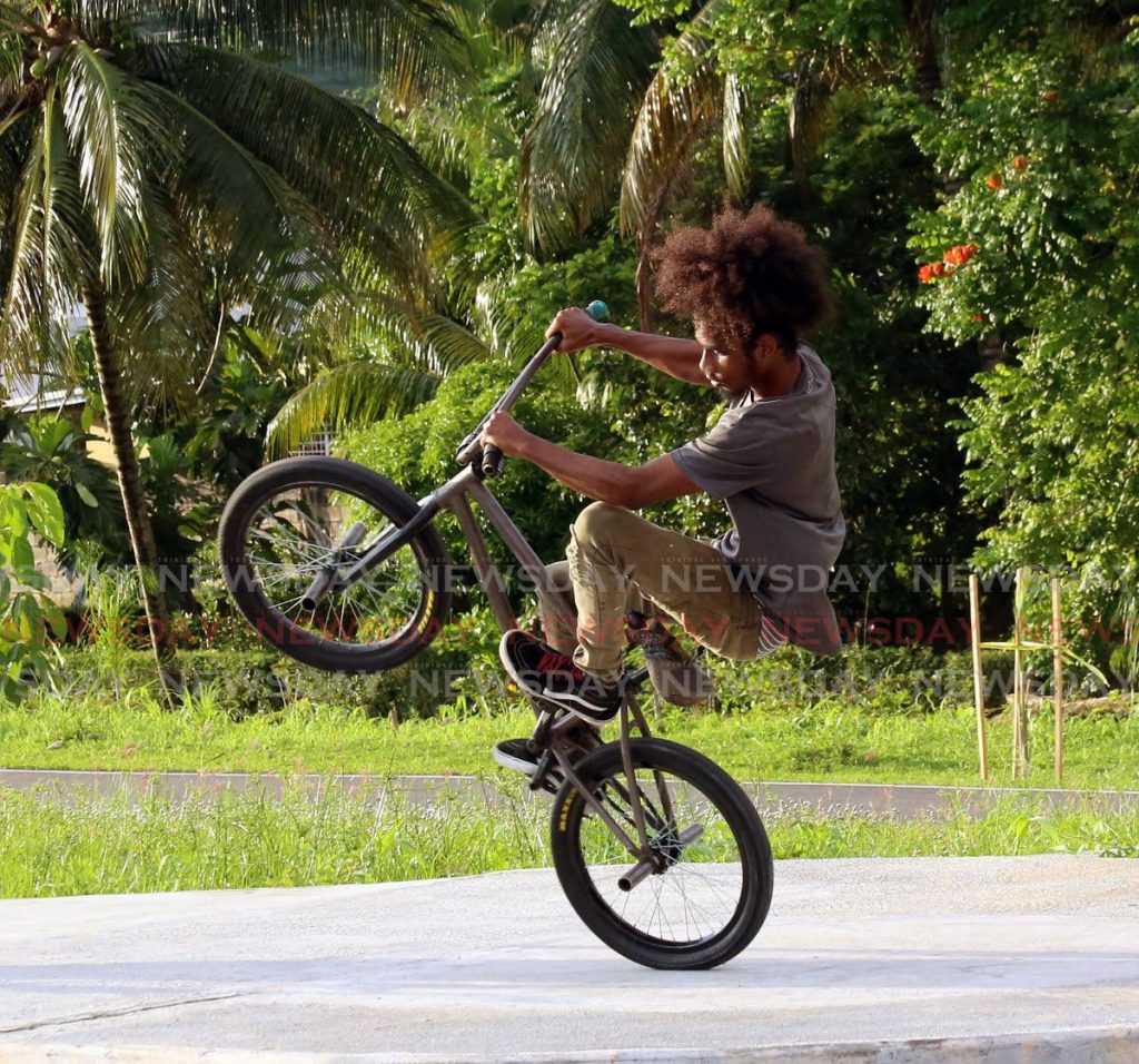 A biker shows off his skills at West Park Savannah, Western Main Road, Diego Martin. - SUREASH CHOLAI