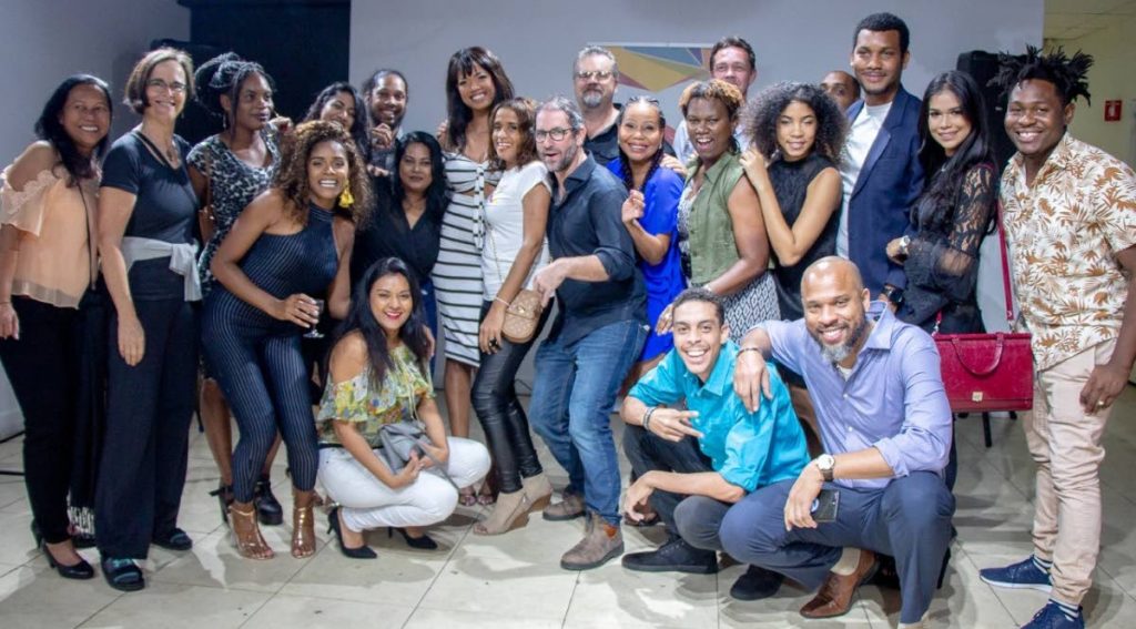 Animae Caribe's full team celebrates. - 