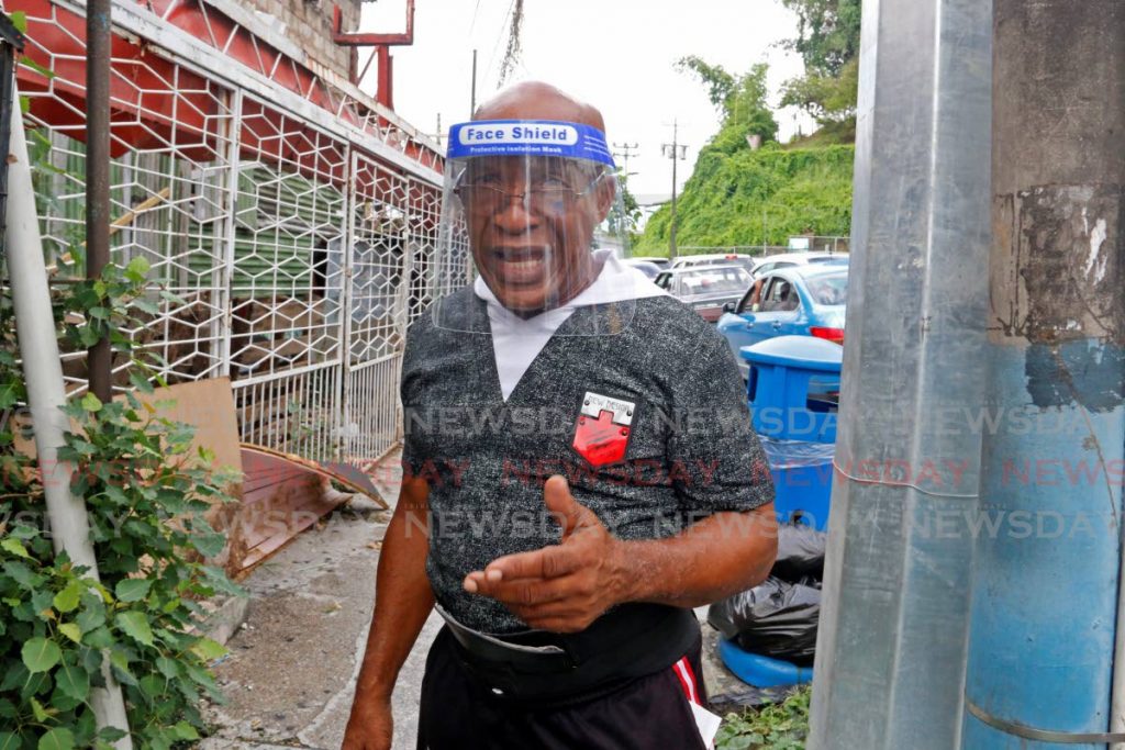 Simeon Santa, owner of Santa Hair & Wig mall on Point-A-Pierre Road, San Fernando, addresses issues of breaking and entering of his establishment by bandits on Tuesday afternoon. - Marvin Hamilton