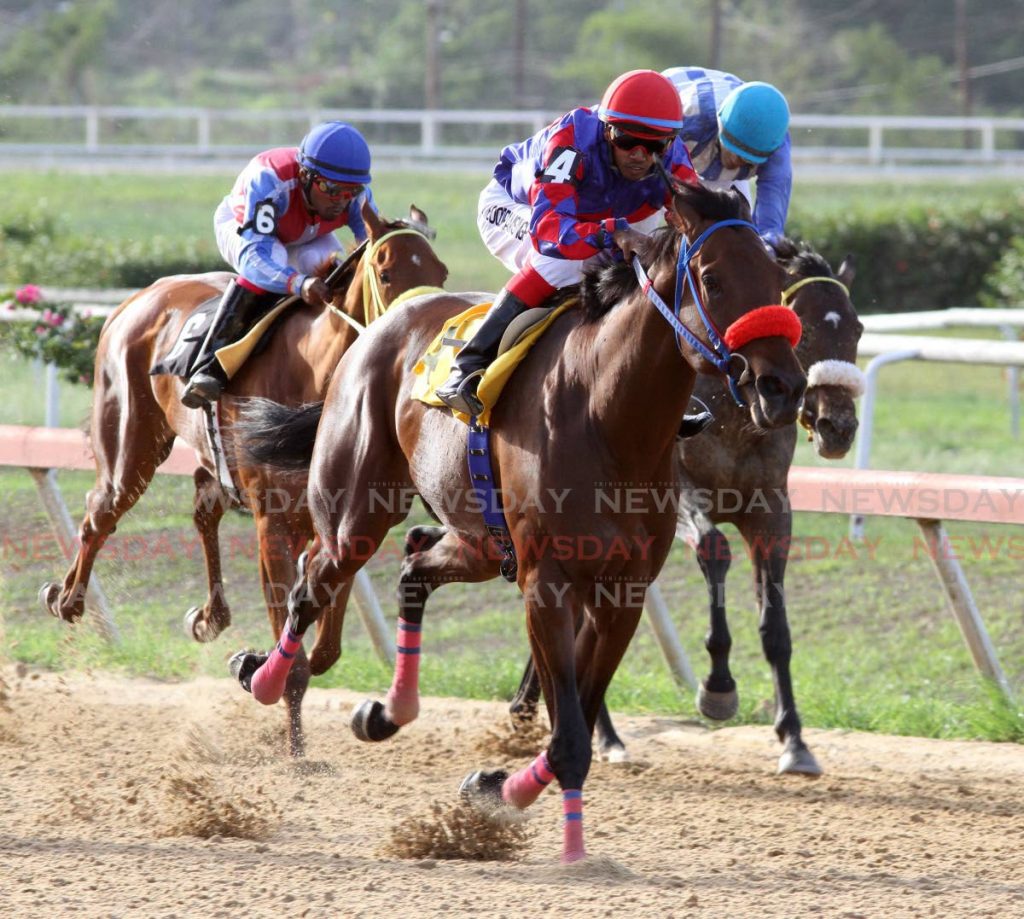 Regal Intension (centre), ridden by Brian Boodramsingh, heads to victory in the 2019 Guineas, at the Santa Rosa Park, Arima.  - 