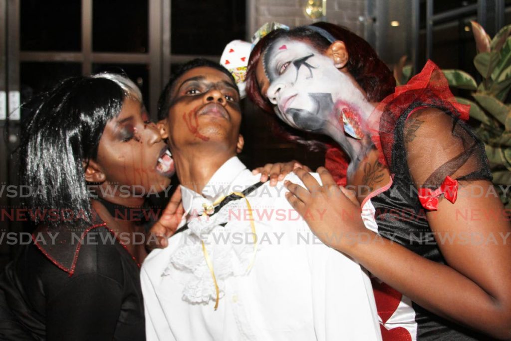In this October 31, 2019 file photo employees of the TGIF restaurant in Trincity dress in costumes to mark Halloween, an American event which is popular in TT. The Prime Minister on Saturday said Halloween may be observed if covid19 cases continue to fall. Currently, in-house dining is not allowed. PHOTO BY ANGELO MARCELLE - 
