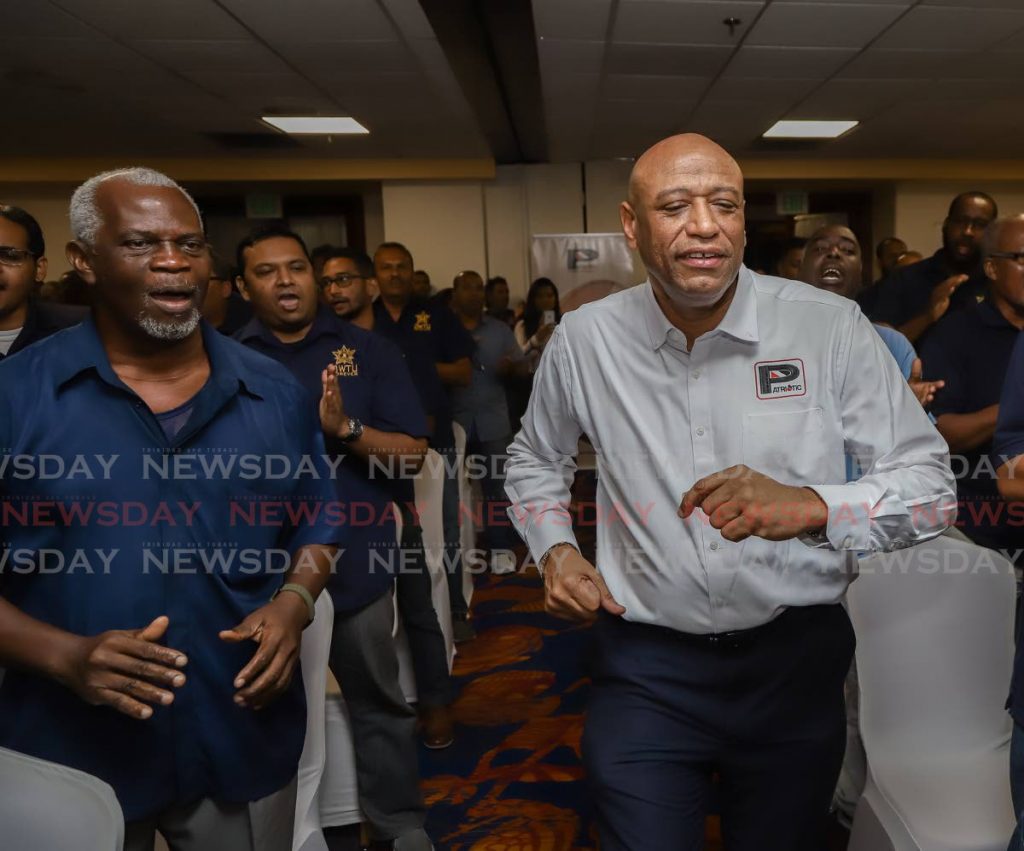 In this November 15, 2019 file photo OWTU president general Ancel Roget sings with union members during the launch of Patriotic Energies and Technologies Ltd at the Radisson, Port of Spain. Government has rejected Patriotic's bid for the Petrotrin refinery. PHOTO BY JEFF MAYERS - 