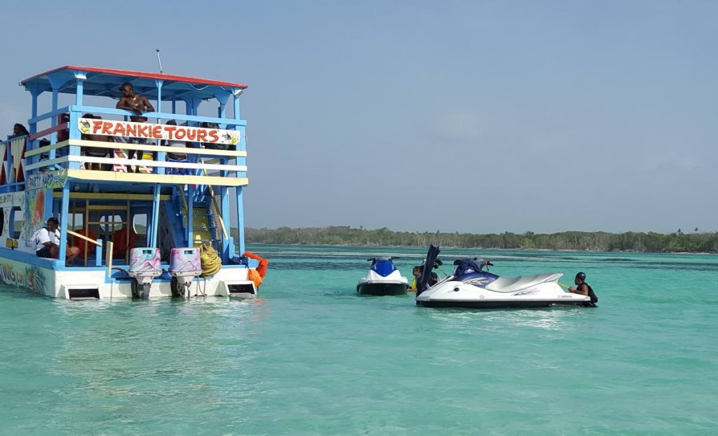 In this file photo, patrons on board Frankie Tours reef boat during a trip to the famous Nylon Pool, in Tobago. 