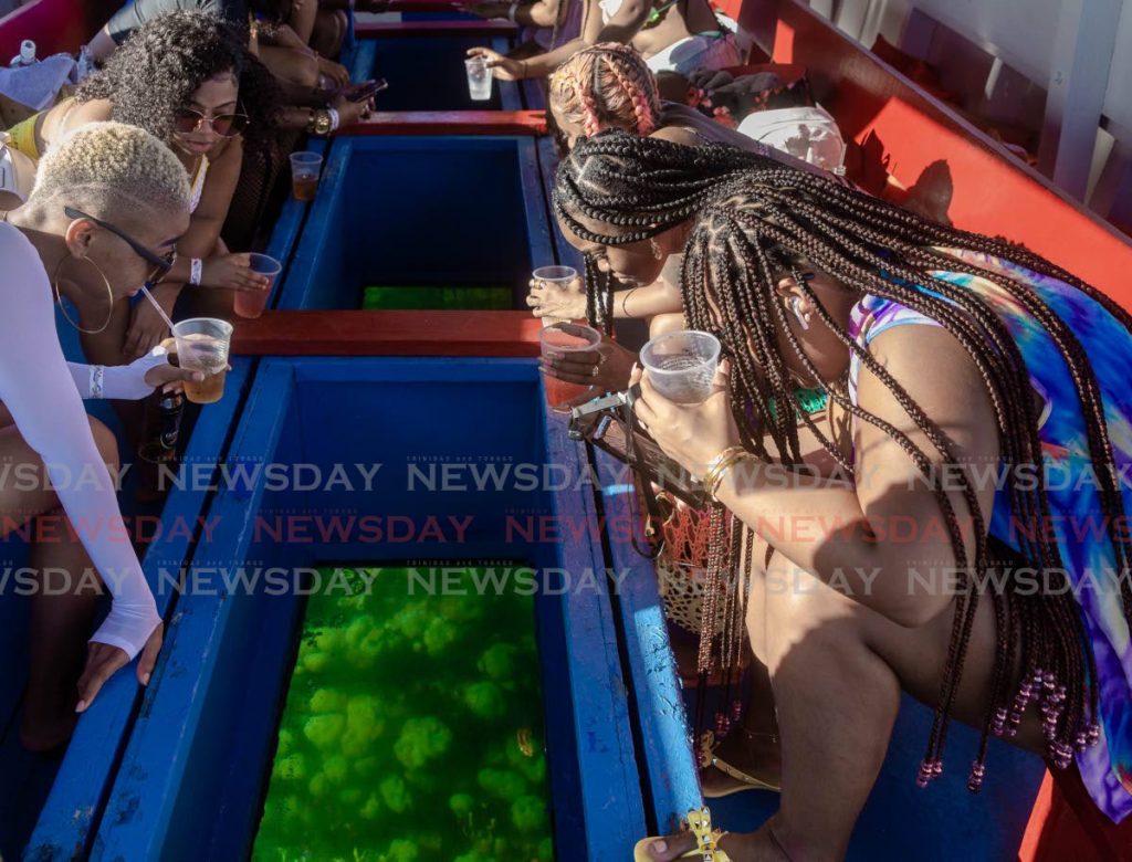 In this July 18, 2020, file photo, Trinidadians enjoy a trip to Buccoo Reef and Nylon Pool on the Ocean One tour boat. On Saturday, the Prime Minister announced that tours can resume for Buccoo Reef in Tobago and at the Caroni Swamp in Trinidad, but with limited numbers. - 