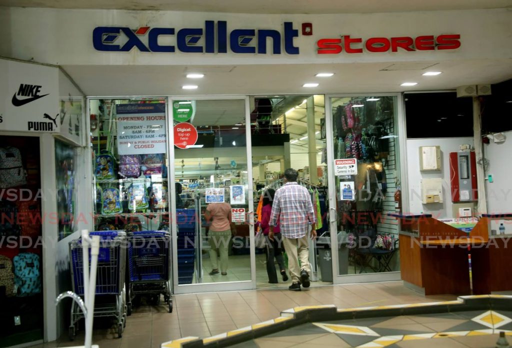 In this August 28 file photo, customers enter Excellent Stores in Port of Spain. The retailer is one of three finalists in the TT Chamber of Industry and Commerce's Champions of Business technology awards. The others are PrinTee and ShupHub. - 