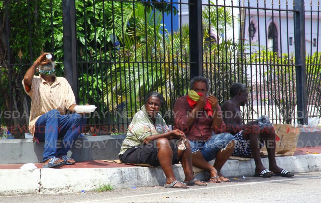 Homeless people are among the most vulnerable to the covid19 virus. In this November 2020 file photo a group gather near Columbus Square, in Port of Spain after being warned by public health officials to adhere to sfety protocols. - ROGER JACOB