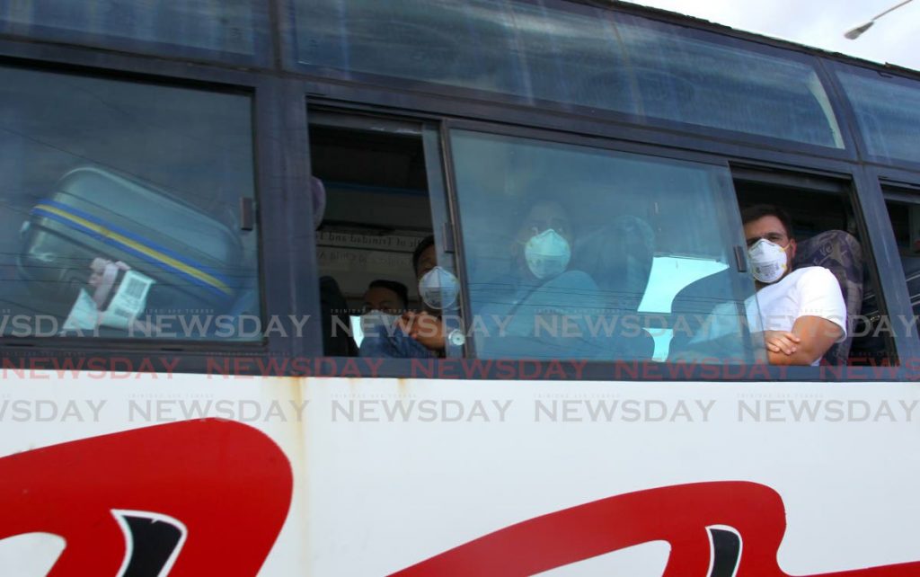 File photo: Returning nationals on board a PTSC bus being taken to a state quarantine facility after arriving at Piarco International Airport in September. - ROGER JACOB