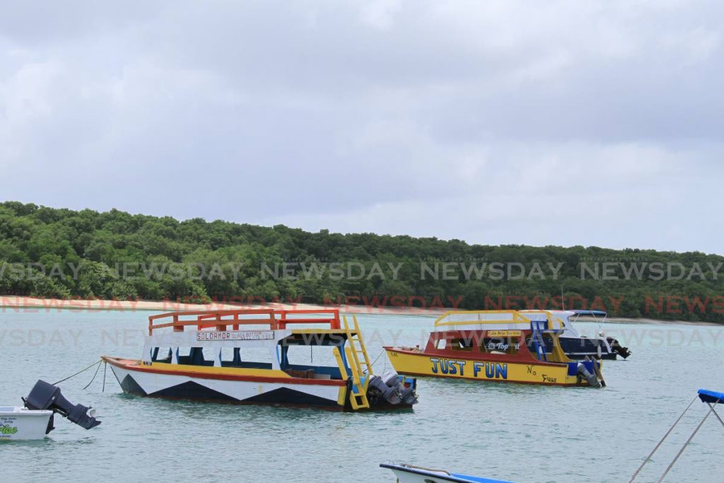 Glass bottom boats at Buccoo, Tobago. - Ayanna Kinsale 