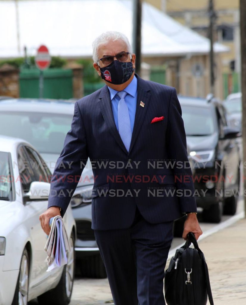 Health Minister Terrence Deyalsingh wearing a mask to safeguard against covid19 arrives at Parliament for the budget debate in the Lower House on October 12.  PHOTO BY SUREASH CHOLAI - 