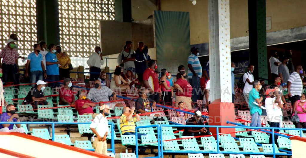 Horse racing fans are glued to the action on the track at Santa Rosa Park in Arima. - SUREASH CHOLAI