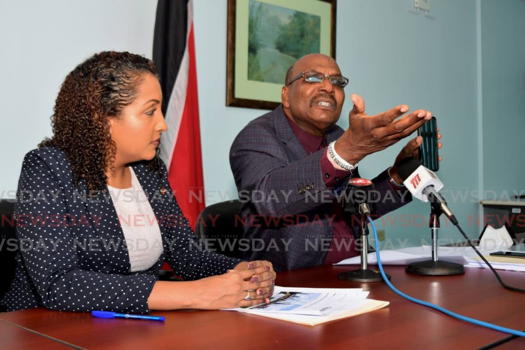 Opposition MP Anita Haynes, left, looks on as Opposition Senator Wade Mark speaks at a press conference held at the Office of the Opposition Leader on Charles Street, Port of Spain on Sunday. - Vidya Thurab