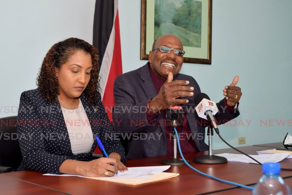 Opposition MP Anita Haynes, left, looks on as Opposition Senator Wade Mark speaks at a press conference held at the Office of the Opposition Leader on Charles Street, Port of Spain on Sunday. - Vidya Thurab