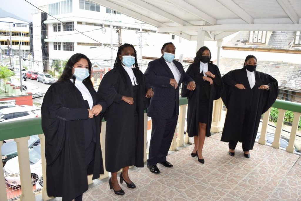 In this 2020 file photo, Port of Spain South MP, attorney Keith Scotland with new lawyers Shivani Maraj, Shalisha Samuel, , Jenna Mapp and Sade McQueen Bernard, on Friday after the four women were called to the bar to practice law in TT. - 