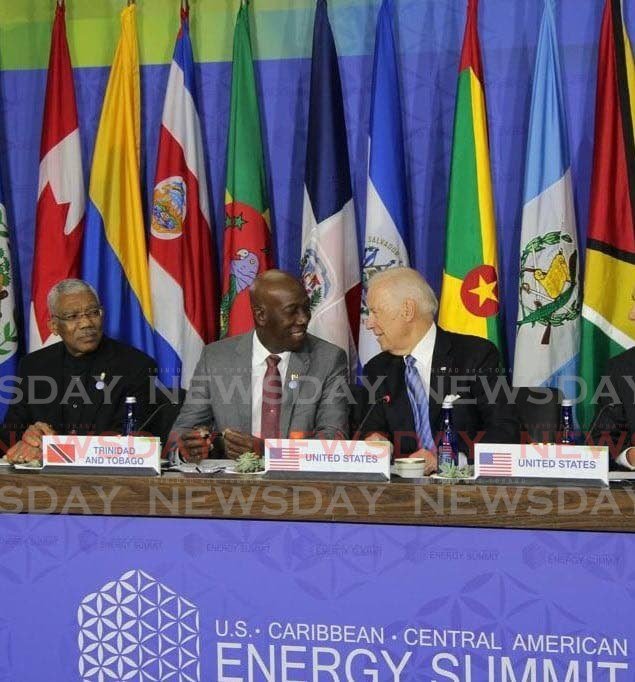 In this May 2016 file photo, Prime Minister Dr Keith Rowley in a friendly conversation with US Vice President Joe Biden, alongiside Guyana president David Granger during the US Caribbean Central America Energy Summit in Washington DC, in May 2016. Biden was elected US president on Saturday, four days after the November 3 election. PHOTO BY CARLA BRIDGLAL - 