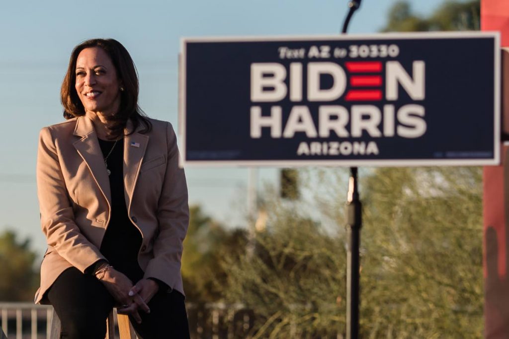  Democratic vice presidential nominee Kamala Harris looks on before speaking during a drive-in campaign rally in Phoenix, Arizona on October 28, 2020. Harris became the first black woman to be elected US vice president. AFP PHOTO - 