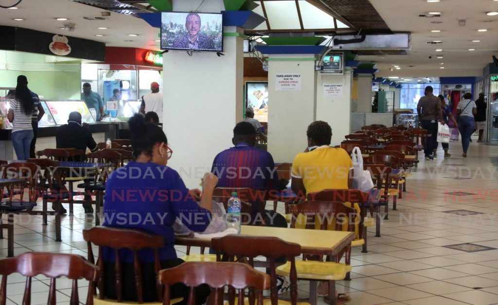 File photo: People eating at Town Centre Mall's food court in Port of Spain after PM Dr Keith Rowley's announcement permitting in-house dining last Saturday. - SUREASH CHOLAI