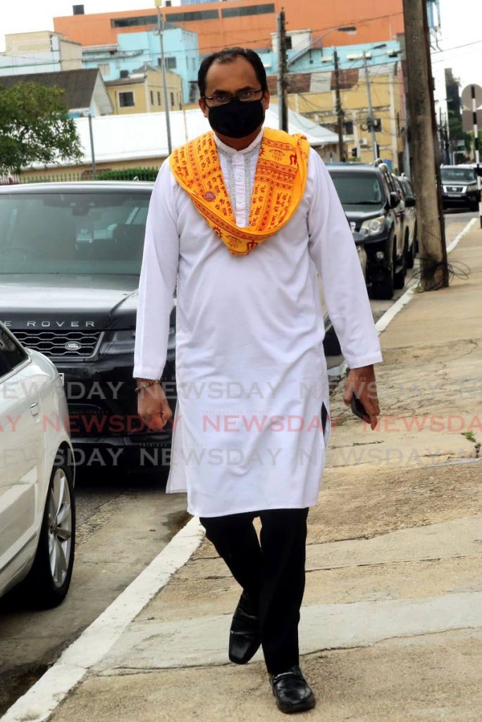 I OBJECT: 
Chaguanas West MP Dinesh 
Rambally, seen in this file photo on his way to 
Parliament recently, has written to the Education Minister in his capacity as 
attorney for the Maha Sabha objecting to the proposed introduction of sex education in primary schools. - 