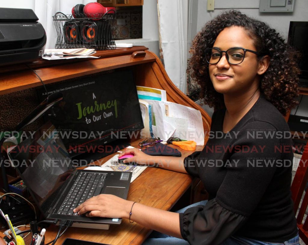 Xala Ramesar reviews her one-minute film A Journey to Our Own at her workstation at her home in Curepe. She won the Youth Jury Award of the tenth annual Green Screen Film Festival’s Very Short Shorts Mobile Film. PHOTO BY ANGELO MARCELLE - 