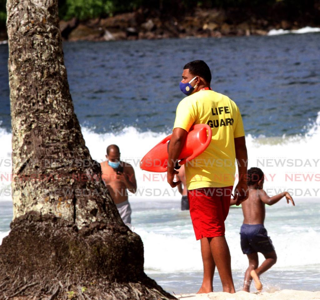 File photo: A lifeguard supervises the safety of beach-goers. Photo by Angelo Marcelle