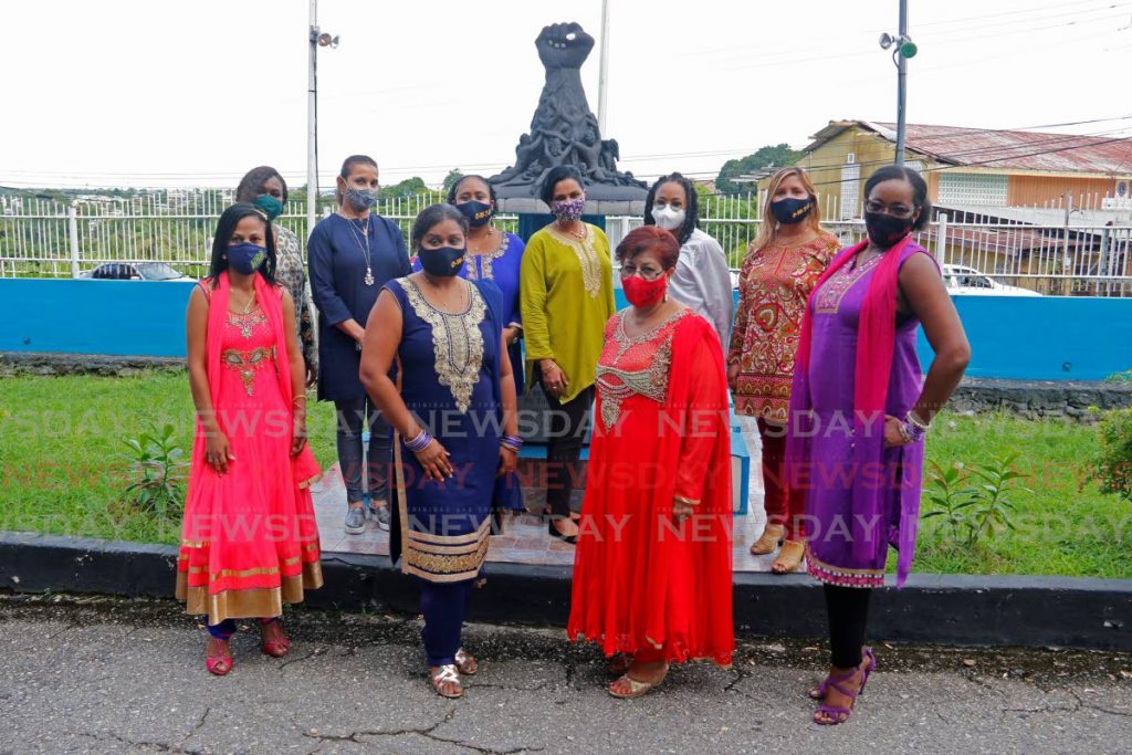 Shubh Divali from staff members of Oil Workers Trade Union (OWTU). Employees dressed in their favorite Indian wear to celebrate the upcoming Divali holiday at the union's head office, Paramount Building, San Fernando on Thursday. - Marvin Hamilton