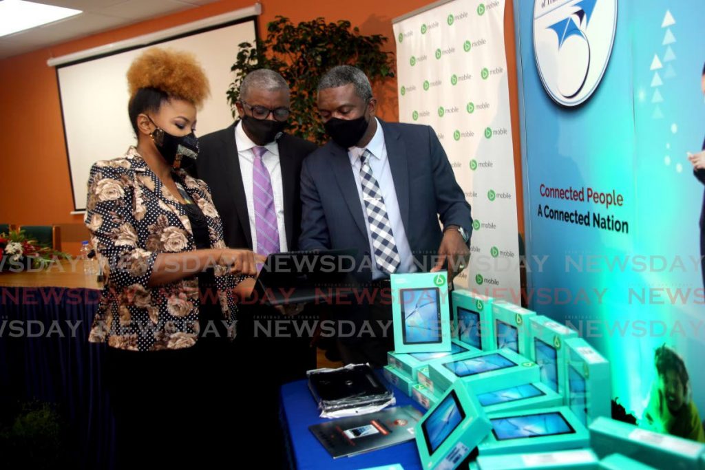 From left Education Minister Dr Nyan Gadsby-Dolly,  TATT 's Chairman Gibert Peterson SC and the Minister in the Ministry of Public Adminstration and Digital Transformation Hassell Bacchus , at the TATT''s head office in Barataria. - SUREASH CHOLAI