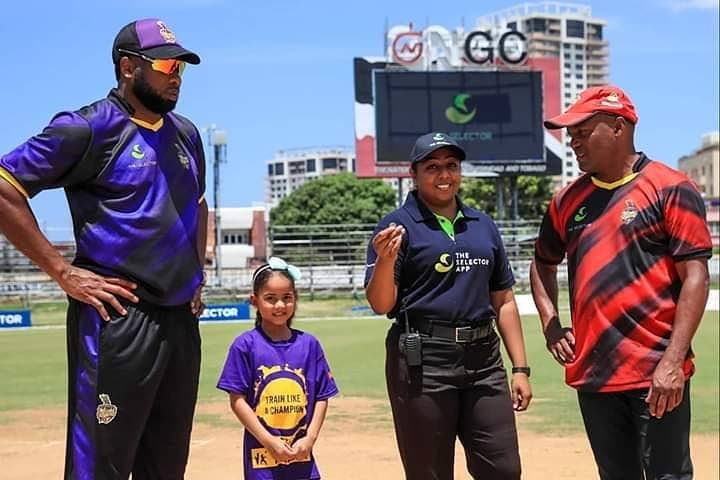 Third umpire Vicki Daniel at the toss in a T20 exhibition game last year featuring Brian Lara, right, and Kieron Pollard, left, at the Queen's Park Oval, St Clair.  - 