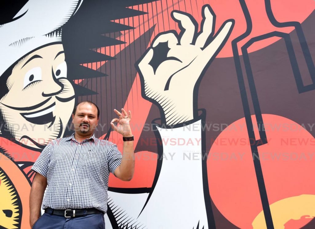 Mario's Pizzeria CEO Roger Harford signals the restaurant chain is here to stay after 48 years as a home-grown enterprise at the newest outlet on Madras Road, St Helena. PHOTO BY AYANNA KINSALE
 - 